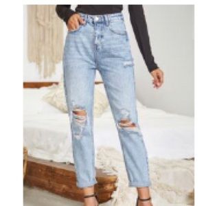 Distressed high-rise boyfriend blue jeans; light wash denim; SHEIN